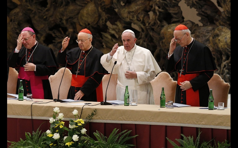 Pope Francis delivers his blessing during an event marking the 50th anniversary of the Synod of Bishops in Paul VI hall at the Vatican Oct. 17. The pope outlined his vision for how the entire church must be "synodal" with everyone listening to each other, learning from each other and taking responsibility for proclaiming the Gospel. (CNS/Paul Haring)