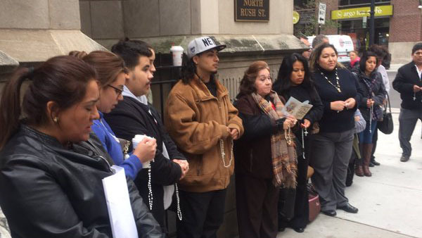 Supporters of Rev. Marco Mercado pray outside the Archdiocese of Chicago. They are seeking to have Mercado reinstated at the Shrine of Our Lady of Guadalupe in Des Plaines, after he was removed for an "inappropriate relationship" with a man.