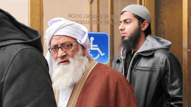 Mohammed Abdullah Saleem, left, founder of the Institute of Islamic Education boarding school, leaves Cook County Circuit Court in Rolling Meadows on Feb. 17, 2015, after being charged in connection with allegations that he groped a 23-year-old woman working at his school. Saleem also was charged Oct. 7, 2015, with criminal sexual abuse based on allegations that he abused a woman when she was a student at his school. (Anthony Souffle, Chicago Tribune)