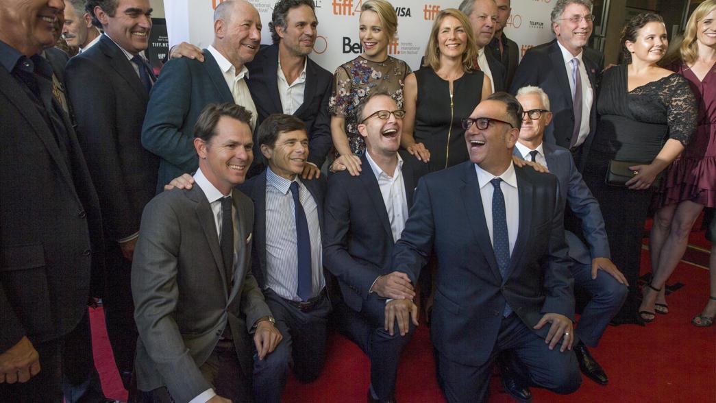 The cast pose with the real life characters they portray as they arrive on the red carpet for the film "Spotlight" during the 40th Toronto International Film Festival.