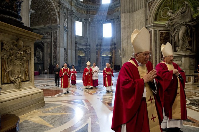 Pope Francis, back center, in St. Peter's Basilica at the Vatican on Tuesday. Two new books explore the Vatican's finances.