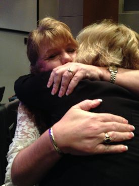 Angela Williams, founder and CEO of Voice Today, a nonprofit that works to raise awareness about child sexual abuse, comforts Amy ... Read More