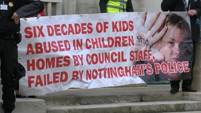 Campaigners unveiled a banner ahead of the meeting at County Hall