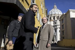 Journalists Gianluigi Nuzzi (R) and Emiliano Fittipaldi (C) arrive at the Vatican November 24, 2015. The Vatican on Saturday ordered five people, including two Italian journalists, to stand trial for leaking and publishing secret documents, in the latest development in a scandal which is rocking the papacy. REUTERS/Alessandro Bianchi