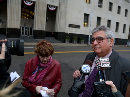 Jerome Sabbota, the lawyer for the Rev. Edward Belczak, stands outside the Theodore Levin United States Court house in Detroit talking to the media after his client was sentenced on Tuesday, Dec. 1, 2015, to 27 months in prison. (Photo: Eric Seals Detroit Free Press)