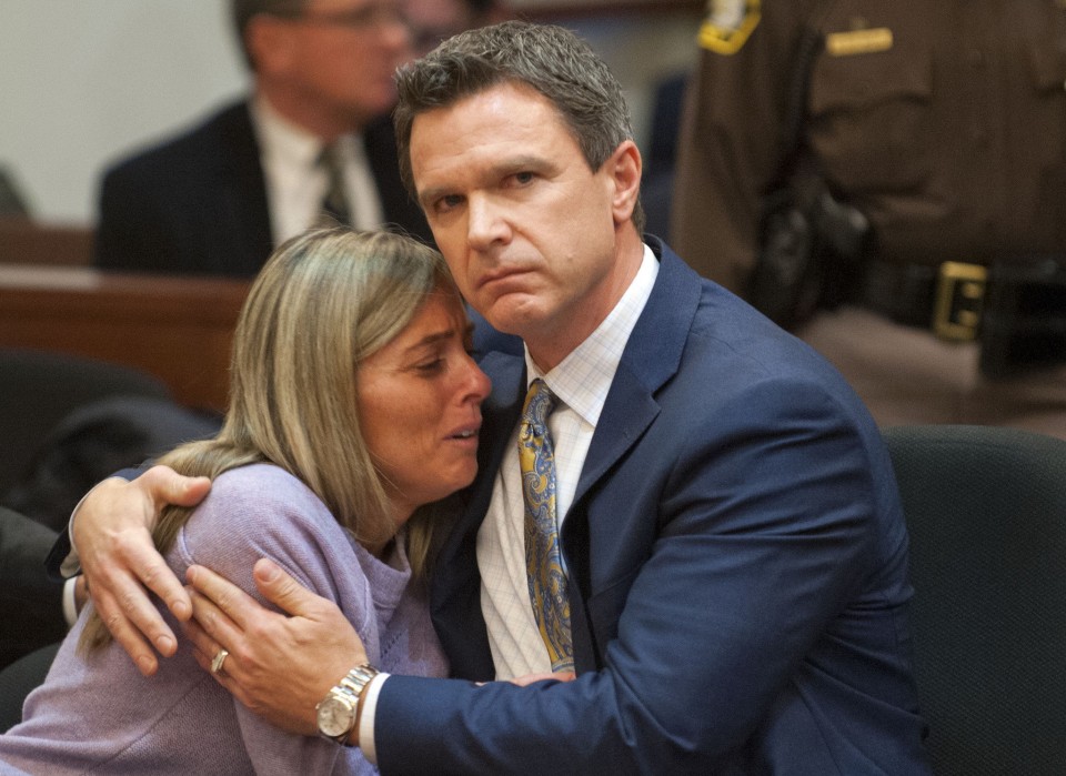 Abigail Simon reacts to the guilty verdict in her trial Wednesday, November 26, 2014. She is held by her attorney Michael Manley. Simon is guilty of having unforced sex with a 15-year-old boy whom she tutored while employed at Catholic Central High School in 2013. (Chris Clark | MLive.com)