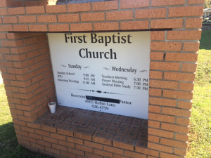 First Baptist Church on Heflin Lane. A black piece of tape covers where McGee’s name was listed.