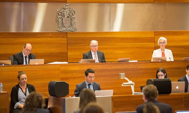 Justice Peter McClellan, centre, at a royal commission into institutional responses to child sexual abuse’s public hearing. Photograph: Royal commission