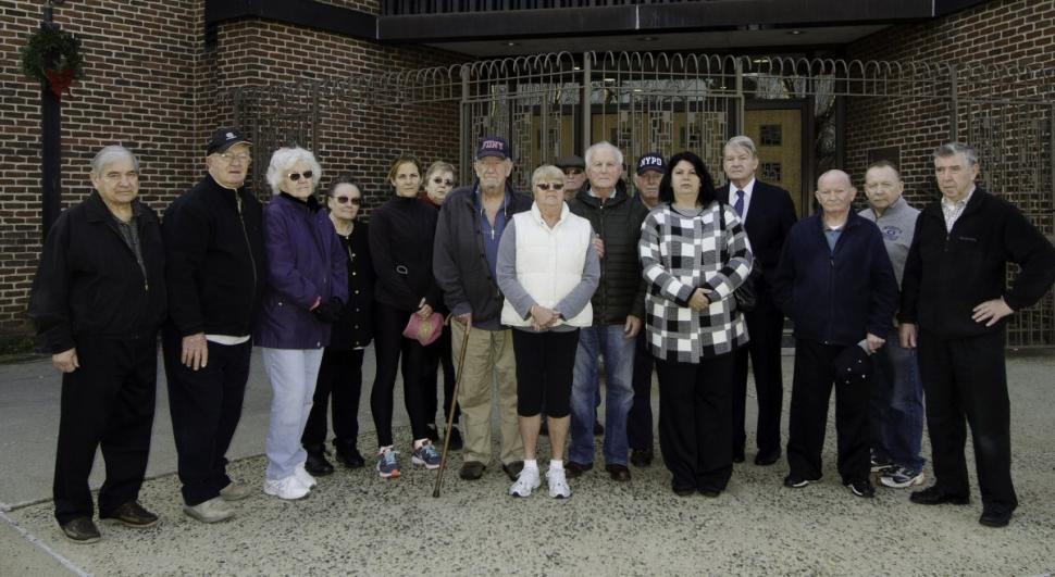 One parishioner (not pictured) said that it was "common knowledge" Miqueli was stealing, as another called him "a troubled man, not a good man."
