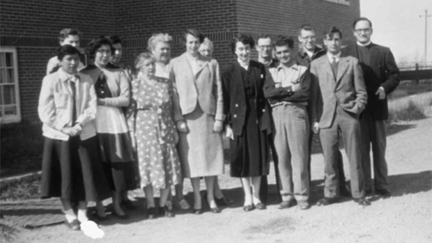 The staff at a residential school in Gleichen, Alta., gather for a photo in 1955. Two female students died in a blizzard in March 1962 after trying to escape. (Glenbow Museum)