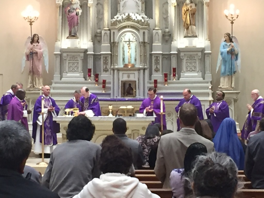 Bishop Thomas J. Olmsted, joined by priests from throughout the Diocese of Phoenix, prepares the altar during a Mass of Healing and Reconciliation at Immaculate Heart of Mary Parish Dec. 1. (courtesy photo)
