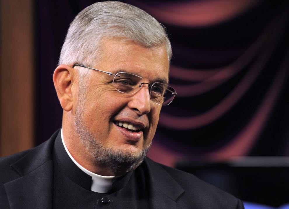 Advocate Staff Photo by Travis Spradling. Father Jeff Bayhi smiles, in between segments being taped for his show 'A Closer Walk with Father Jeff Bayhi.' Bayhi pastors two churches and does the show, which was taping Thursday, June 14, 2012, in Catholic Life Television's studio in the Bishop Robert E. Tracy Center, at the Catholic Life Center. MAGS OUT / INTERNET OUT/ONLINE OUT/NO SALES/TV OUT/FOREIGN OUT/ LOUISIANA BUSINESS INC./GREATER BATON ROUGE BUSINESS REPORT/225/10/12/IN REGISTER/LBI CUSTOM PUBLICATIONS OUT/