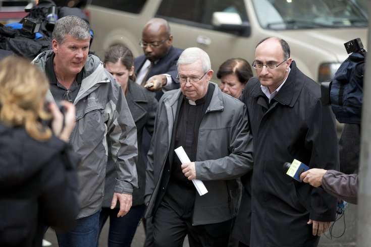 In this file photo, Monsignor William Lynn walks from the criminal justice center after a bail hearing, Monday, Jan. 6, 2014, in Philadelphia.