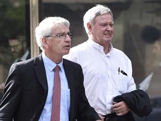 An Australian Catholic bishop (R) accused of protecting himself at an abuse inquiry has resigned.