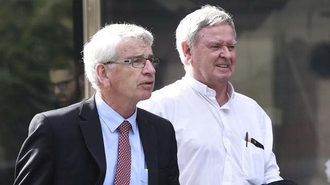 Brisbane bishop and former Ballarat vicar-general Brian Finnigan, right, leaves the Abuse Royal Commission public hearing into Catholic Church authorities in Ballarat earlier this month.