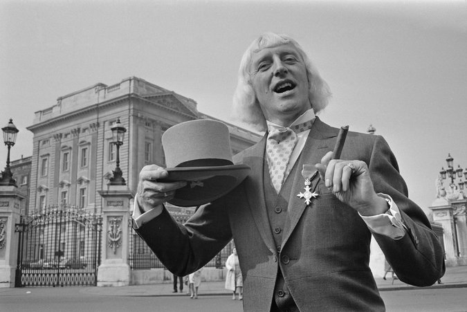 Jimmy Savile after being appointed an officer of the Most Excellent Order of the British Empire at Buckingham Palace in London in 1972. Credit Les Lee/Hulton Archive, via Getty Images