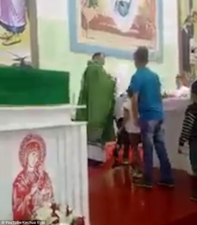 One of the youngsters in the line-up covers his hair with his hands to avoid the bizarre treatment
