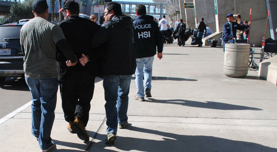 In this Friday, Jan. 29, 2016 photo provided by the U.S. Immigration and Customs Enforcement (ICE), former Columbus, Ohio, seminarian Joel Wright, second left, is arrested at San Diego’s airport in San Diego on federal charges for allegedly seeking to have sex with infant and young girls in Mexico. (U.S. Immigration and Customs Enforcement via AP) AP