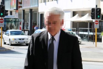 PHOTO: Max Davis, pictured arriving at court on Monday, denies abusing five students at St Benedict's College in New Norcia. (ABC News: Rebecca Trigger)