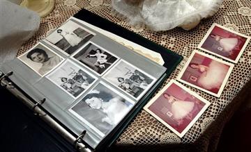 (Delcia Lopez /The San Antonio Express-News via AP). In this photo taken on March 11, 2004, family photos of Irene Garza as a teen and beauty queen are displayed at the home of her aunt Herlynda De La Vina in Edinburg, Texas. A former priest was arrest...