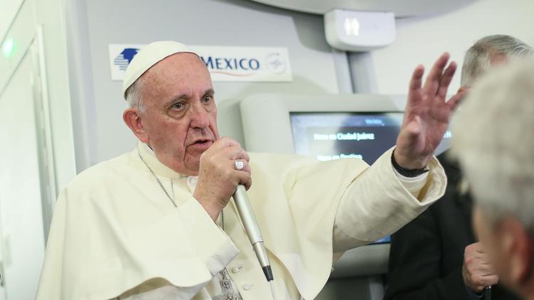 Pope Francis speaks to journalists aboard the flight from Mexico to Italy on Thursday. (Alessandro di Meo / AFP/Getty Images)