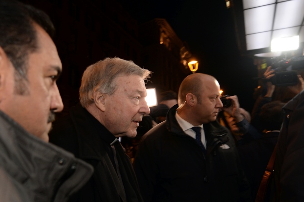 George Pell, centre, arrives at the Quirinale hotel in Rome to give evidence via video-link to Australia's Royal Commission into Institutional Responses to Child Sexual Abuse on March 1. (Filippo Monteforte/AFP/Getty Images)