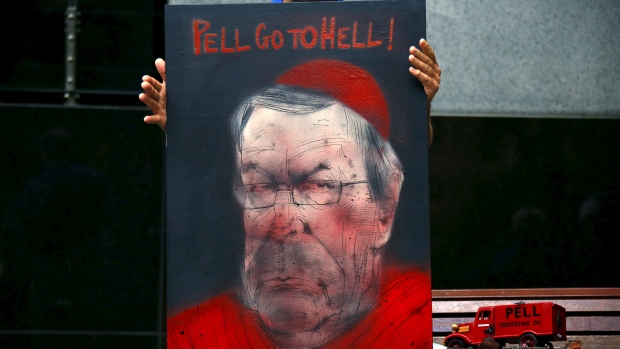 Victims and relatives of children who claim they were sexually abused by the Catholic Church hold placards as they stand outside the venue for Australia's Royal Commission into Institutional Response to Child Sexual Abuse in Sydney on Feb. 29. (David Gray/Reuters)