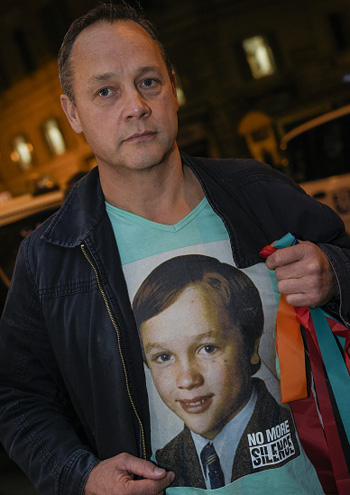 Catholic child abuse victim Peter Blenkiron, wearing a t-shirt showing him at the age he was abused. Photo: Getty