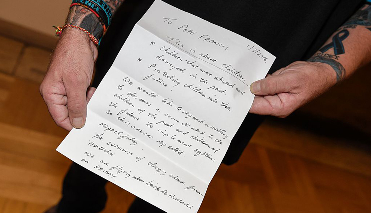 Survivor Paul Levy holds a letter addressed to the Pope Francis requesting a private meeting. Photo: Getty