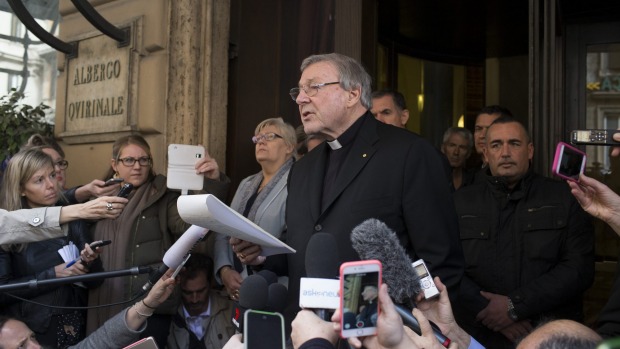 Cardinal George Pell reads a statement after meeting with abuse survivors in Rome this week. Photo: Marco Di Lauro