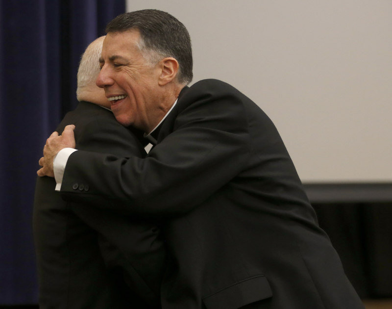 Bishop Paul Bootkoski hugs Reverend Monsignor James Checchio at the press conference after Pope Francis appointed Reverend Monsignor James Checchio to serve as bishop for the Roman Catholic Diocese of Metuchen and he was introduced today at a press conference in Piscataway. 3/7/16 (Ed Murray | NJ Advance Media for NJ.com)