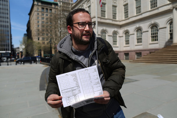 Chaim Levin, 26, showed his third-grade report card, which listed marks in areas like prayer. He said he never learned algebra. Credit Chang W. Lee/The New York Times