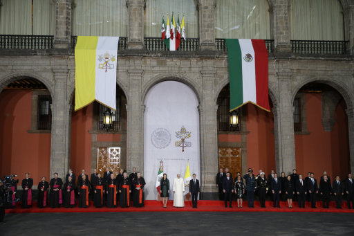 Pope Francis is welcomed by Mexican President Enrique Pena Nieto at the Presidential Palace in Mexico City.