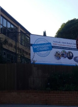 A billboard outside Yeshivah Centre's Beth Rivkah Ladies College announcing the milestone.