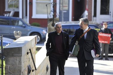 Franciscan Robert D'Aversa arrives to his hearing at the Blair County courthouse in Hollidaysburg, Pa., Thursday, April 14, 2016. Three Franciscan friars face a hearing on charges they allowed a suspected sexual predator to teach at a Pennsylvania high school and hold other jobs where he molested more than 100 children. Thursday's hearing will determine whether D'Aversa, Anthony Criscitelli, and Giles Schinelli stand trial on child endangerment and conspiracy charges. (Todd Berkey/Tribune-Democrat via AP)
