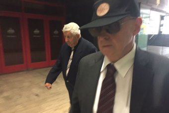 PHOTO: Vincent Gerard Ryan (right) with a supporter (left) outside court.