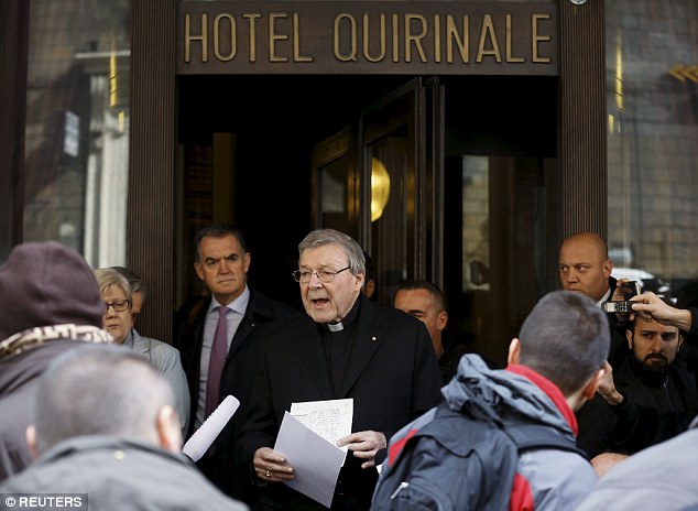 Cardinal George Pell (C) speaks at the end of a meeting with the sex abuse victims in Rome in March
