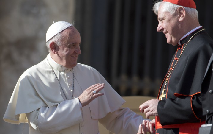 Pope Francis talks with Cardinal Gerhard Ludwig Muller at the end of his weekly general audience, in St. Peter’s Square at the Vatican, Wednesday, Nov. 19, 2014. (AP Photo/Andrew Medichini)