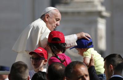 Pope Francis greets children during his general audience in St. Peter's Square at the Vatican, June 8 (CNS photo/Paul Haring).