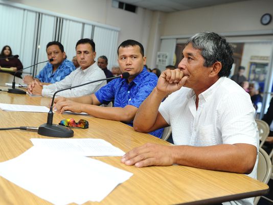 John "Champ" Quinata, right, pauses for a moment during a public hearing, to gather his thoughts as recalls what his late brother, Joseph 'Sonny' Quinata, said about his alledged child sexual abuse, by then-Father Anthony Apuron, when they were children. Senators heard testimony from the public on July 28, regarding Bill 326 which proposes to repeal the statute of limitations in case involving child sex abuse.