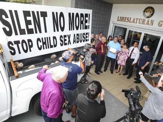 Sen. Frank Blas Jr., center, speaks after receiving a petition with more than 3,000 signatures from Silent No More campaign founder Joe Santos, during a brief ceremony at the Guam Legislature in Hagatna on Thursday. The signatures were gathered in an effort to raise awareness about the removal of the statute of limitations on civil suits regarding sexual abuse of children. Blas has introduced Bill 326 to address the issue. See story, Page 3