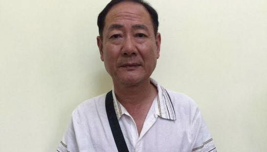 South Korean pastor Park Youl has his photo taken at a Siem Reap police station after he was arrested for sexually assaulting minors. Photo supplied