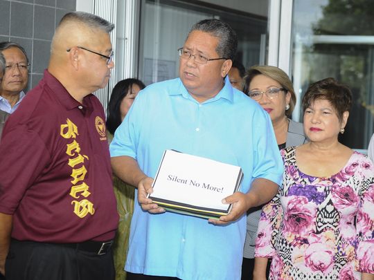 In this Sept. 8 file photo, Sen. Frank Blas Jr., center, speaks after receiving a petition with over 3,000 signatures from Silent No More campaign founder Joe Santos, during a brief ceremony at the Guam Legislature in Hagatna. (Photo: PDN file photo)