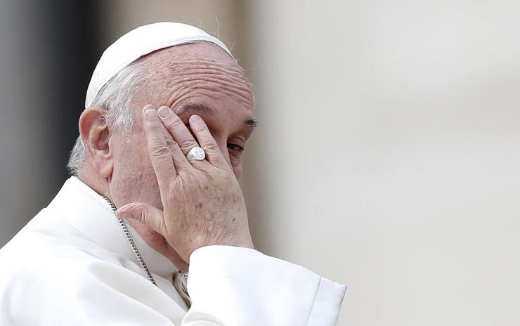Pope Francis touches his forehead during his Wednesday general audience in Saint Peter's square at the Vatican October 21, 2015. Reuters/Alessandro Bianchi