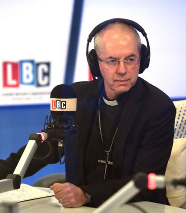 The Archbishop of Canterbury Justin Welby appears on breakfast presenter Nick Ferrari's LBC show at the Global Radio studios in London.