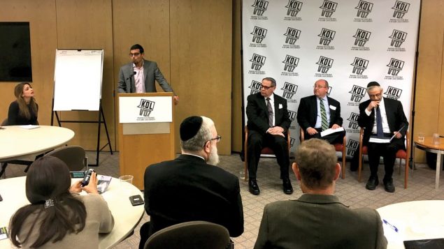 Manny Waks, at the podium, convened a conference here last week on sexual abuse in the Jewish community. Panel members included, from left, Rabbi Mark Dratch, David Cheifetz and Rabbi Chaim Dovid Zwiebel. JOSH MENDLOWITZ
