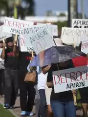 "Defrock Apuron" and "Apuron Out" signs are scattered throughout a picket line at the Dulce Nombre de Maria Cathedral-Basilica in Hagatna on Jan. 29, 2017. (Photo: Frank San Nicolas/PDN)
