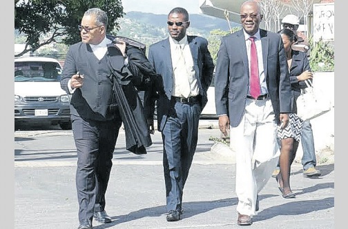 Attorney Pierre Rogers (left) with clients Jermaine Gibson (centre) and Dr Paul Gardner.
