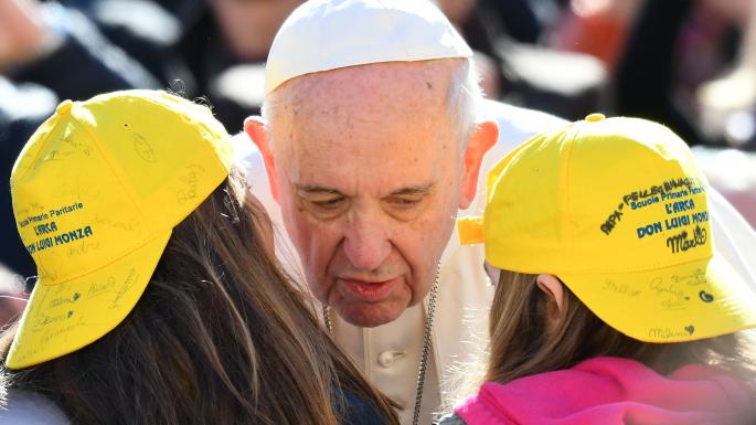 The Pope greets children at his weekly audience in St Peter’s Square yesterday Vatican