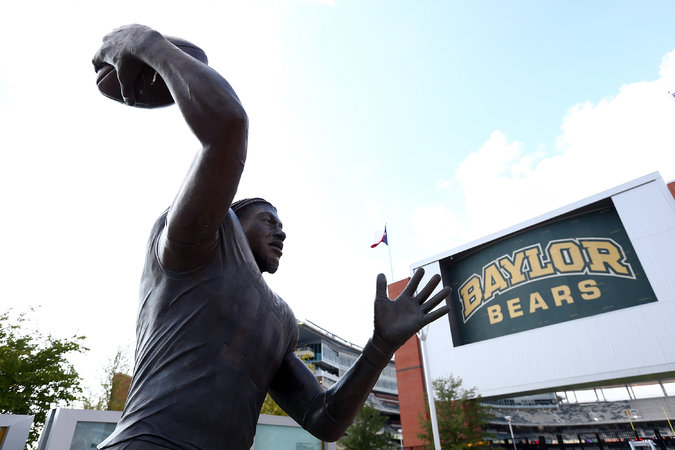 A statue of the former Baylor quarterback Robert Griffin III, the school’s only Heisman winner, outside McLane Stadium. Credit Ronald Martinez/Getty Images